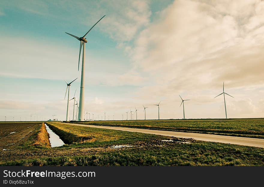 Windmill Energy on Green Grass Field