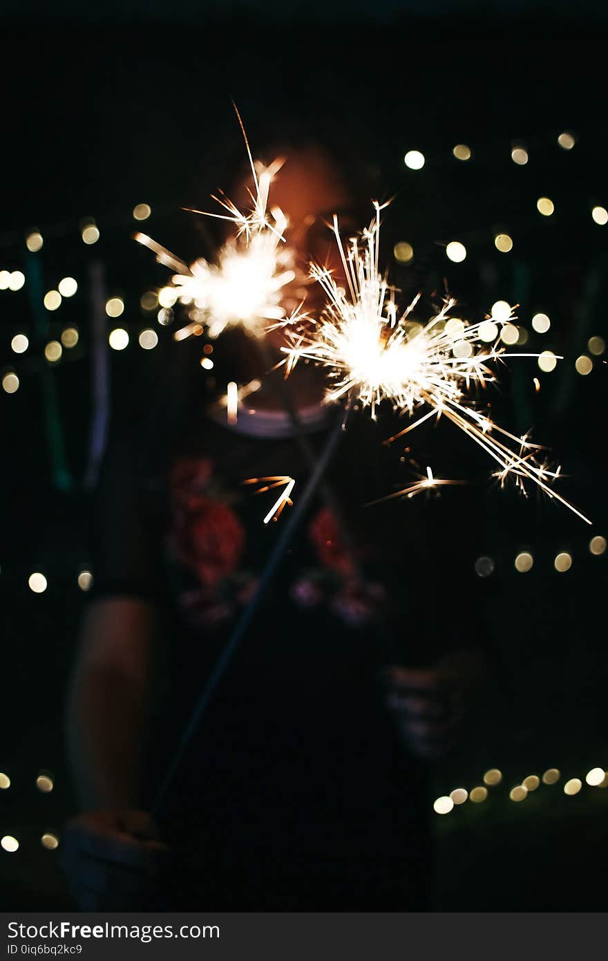 Bokeh Photography of Photo of Person Holding Sprinkler