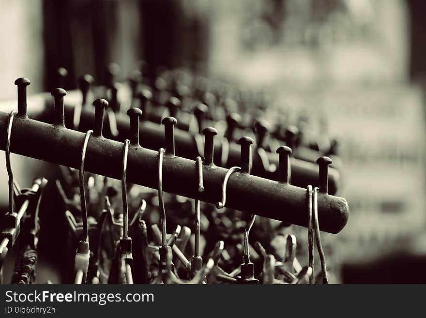 Grayscale Photography of Hangers on Rack