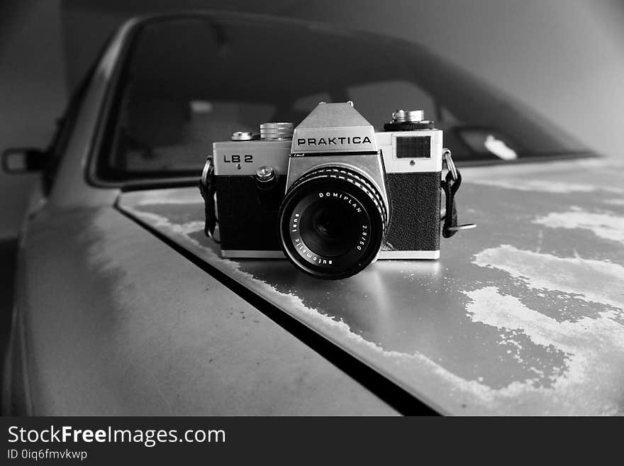 Gray Scale Photography of Silver and Black Praktica Dslr Camera