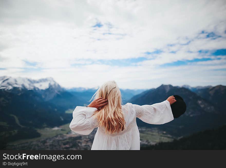 White Dressed Girl Across Black Mountains