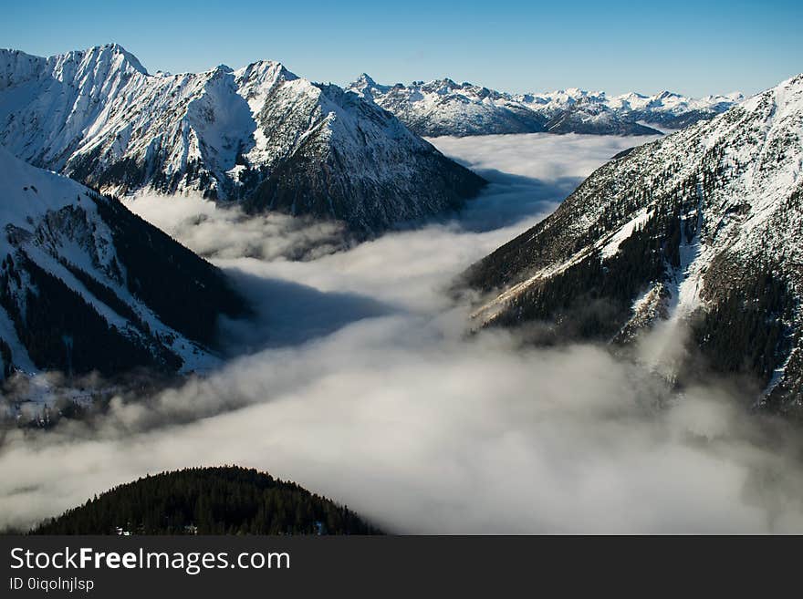 Rocky Mountain With Fog in Daytime Photo