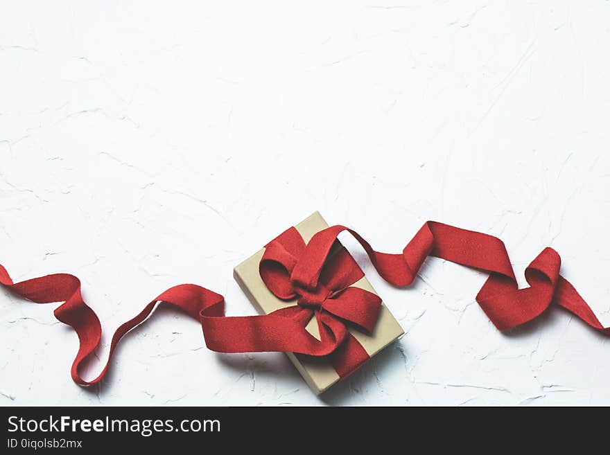 Red and White Gift Box With Ribbon Bow