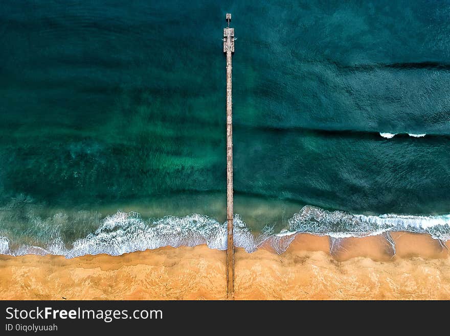 Aerial Shot of Gray Dock on Body of Water