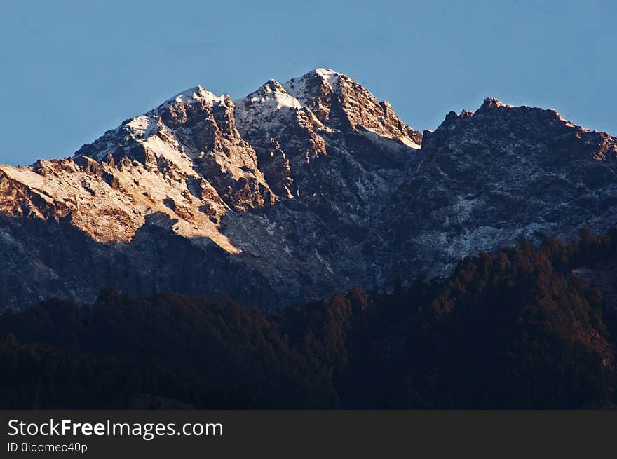 Brown and White Mountain Under Clear Sky