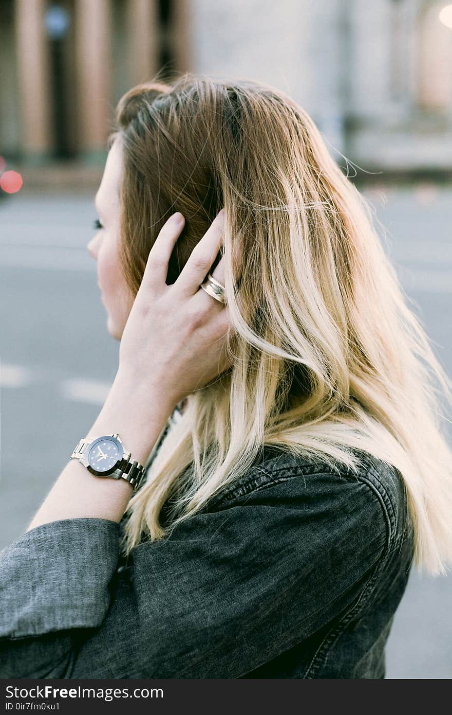 Brown Haired Woman Holding Her Hair