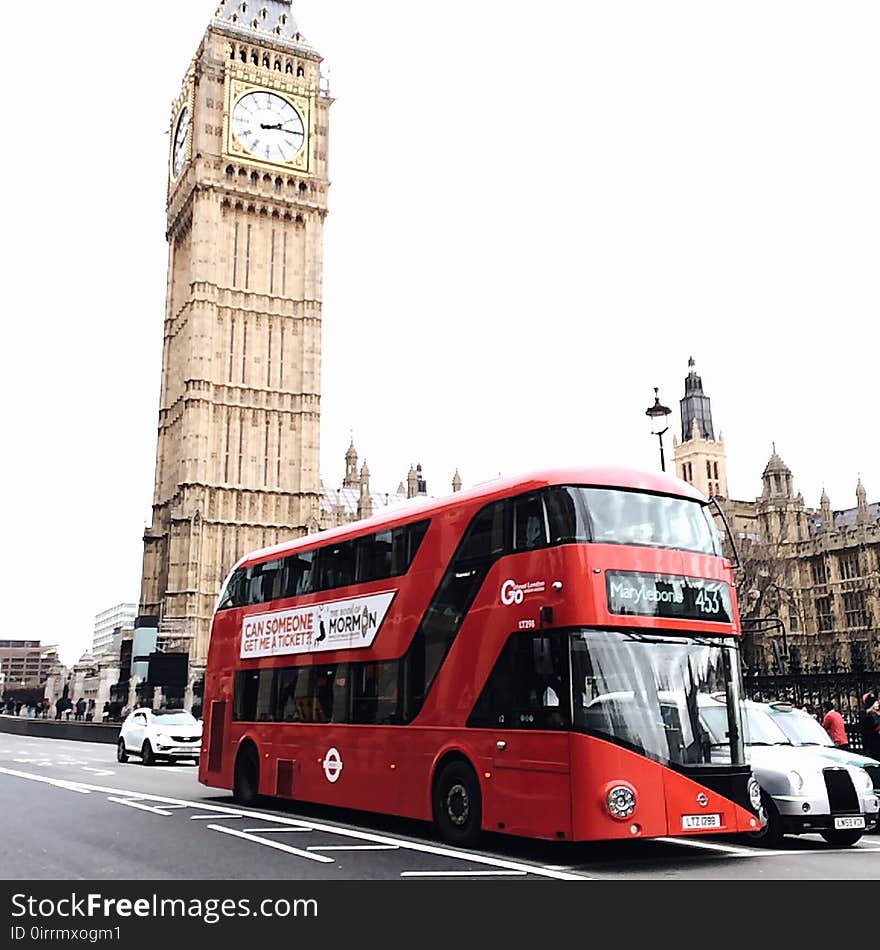 Red Bus on Road Near Big Ben in London