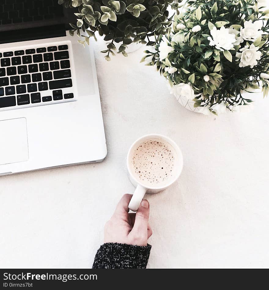 Person Holding Cup of Coffee