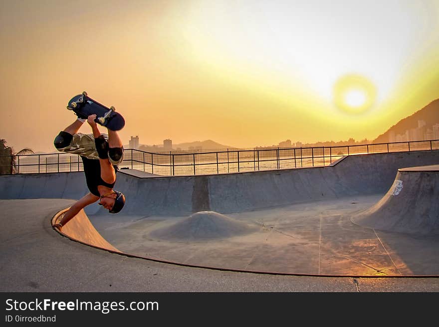 Man In Black Tank Top Skateboarding Wearing Helmet