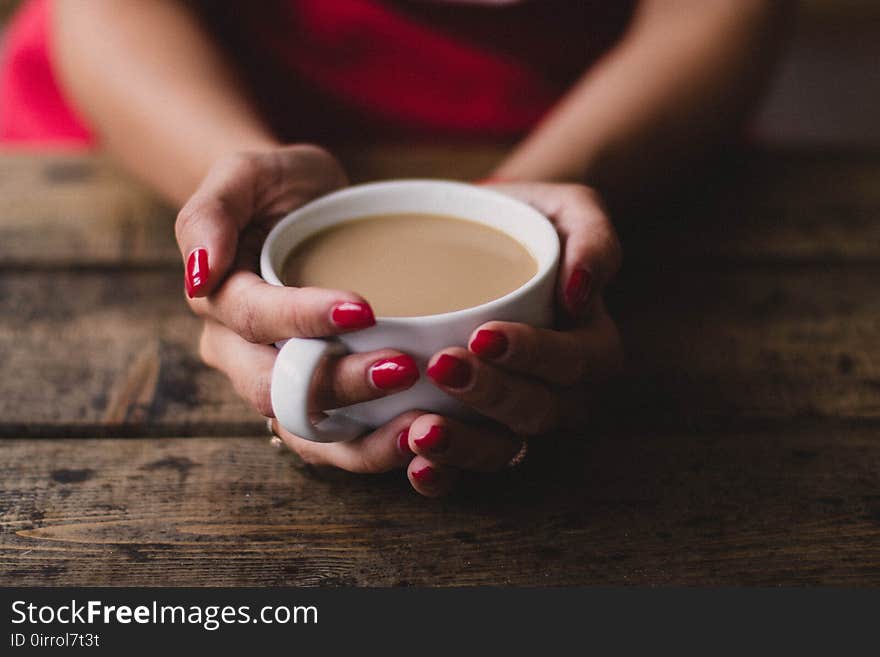 Women Holding Cup Of Coffee