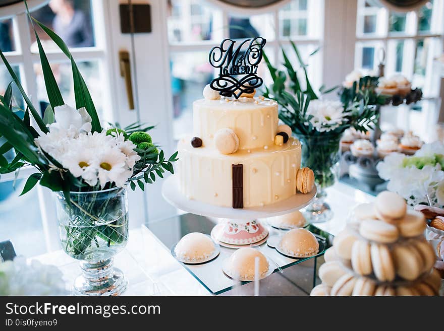 Candy Bar And Wedding Cake With Flowers. Table With Sweets, Buffet With Cupcakes, Candies, Dessert.