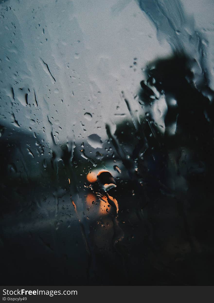 Shallow Focus Photography of Rain on the Window