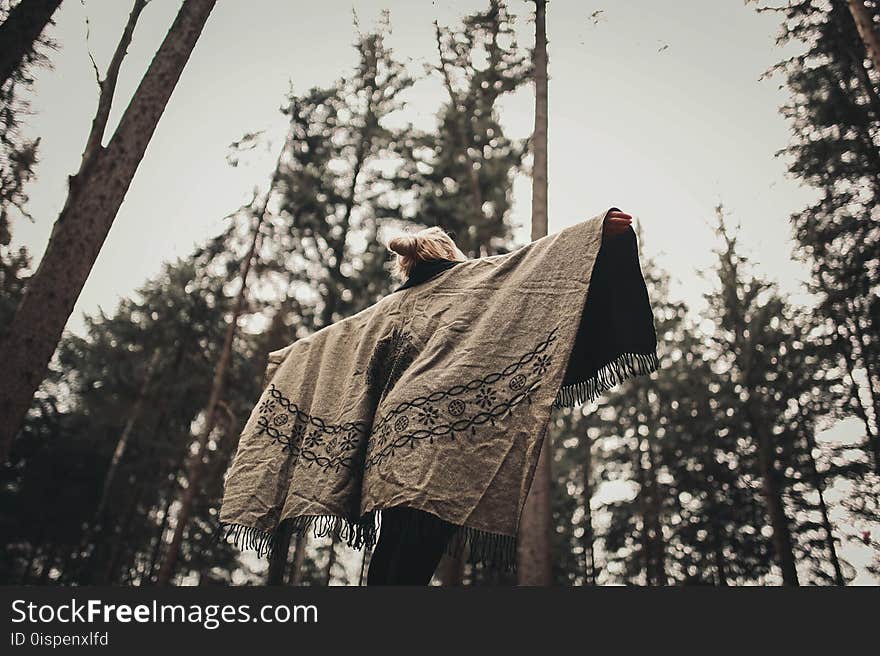 Person Spread Her Arms Wearing Gray Jacket