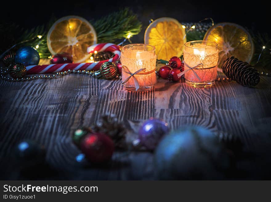 A Couple of Magic Christmas decorated Burning candles on wooden rustic background 1.