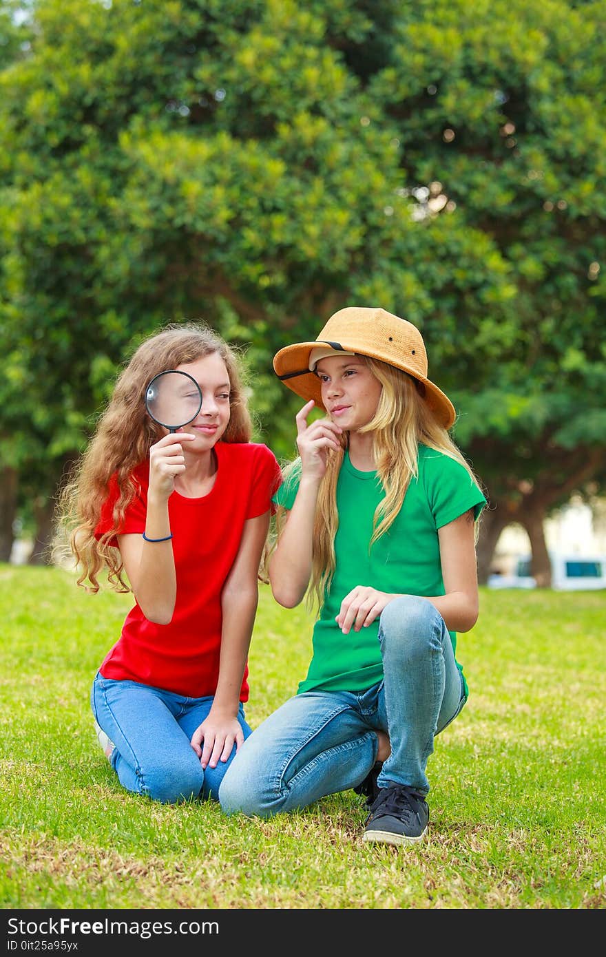 Two school girls exploring the nature