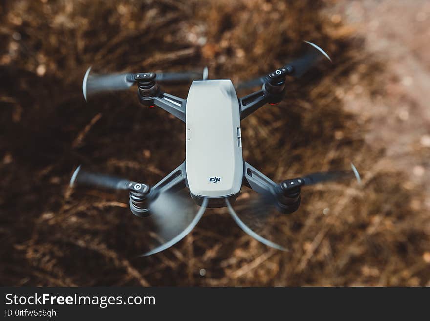 Selective Focus Photography of White and Black Quad Copter