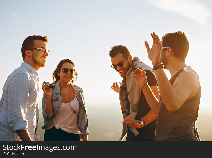 Group of People Having Fun Together Under the Sun