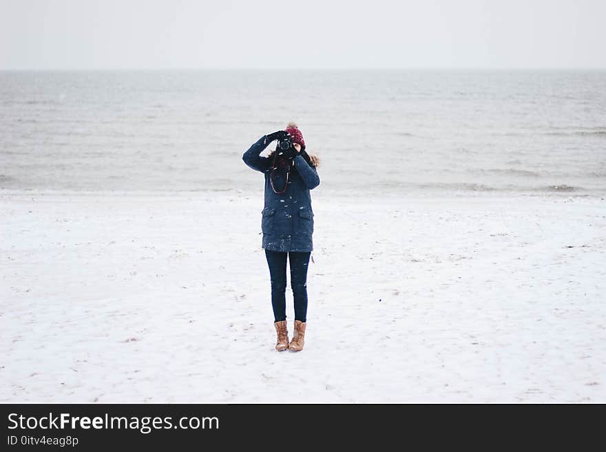 Woman Taking Picture on the Beach View