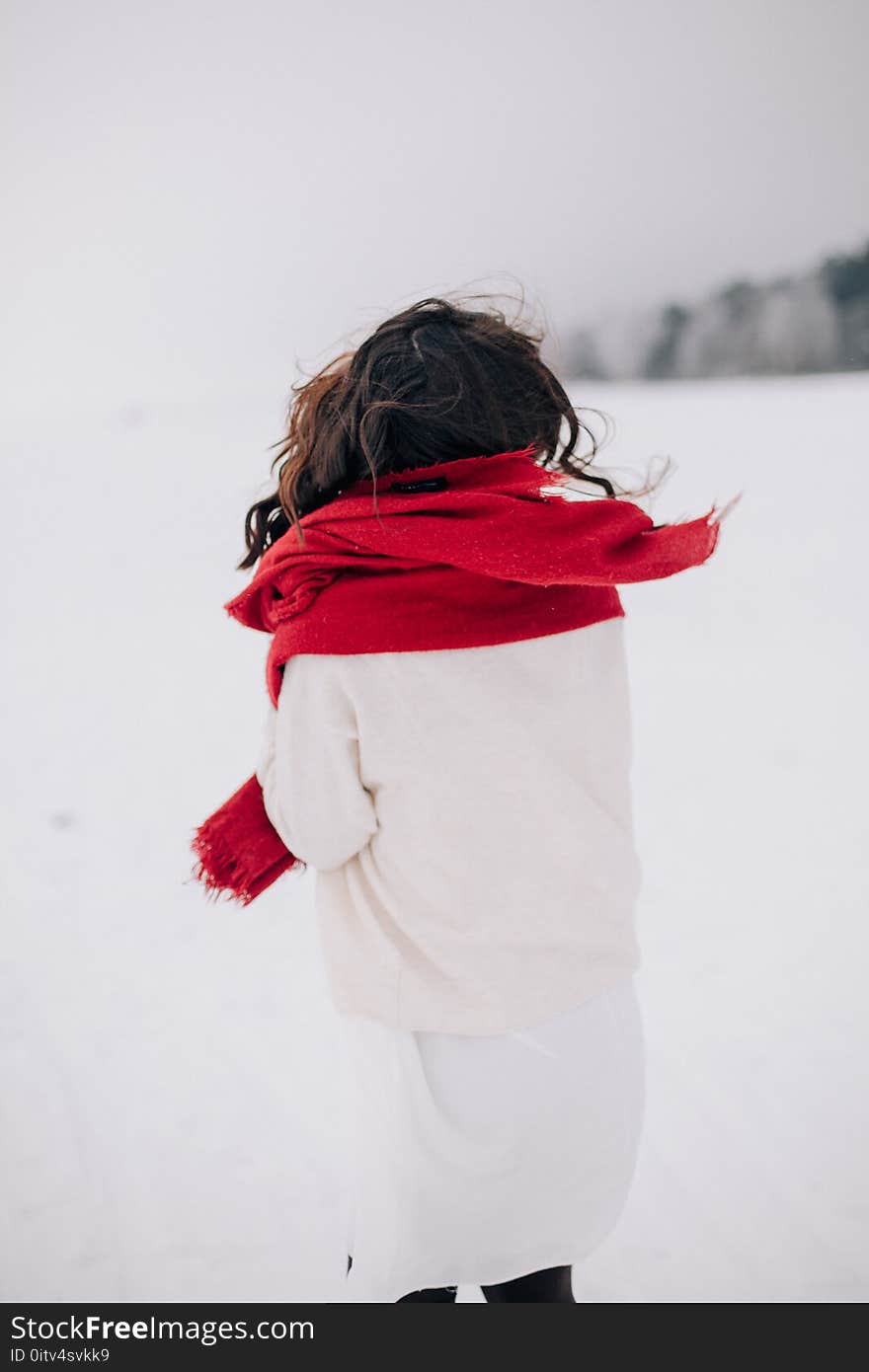 Woman Wearing White Long-sleeved Shirt Standing on Snow