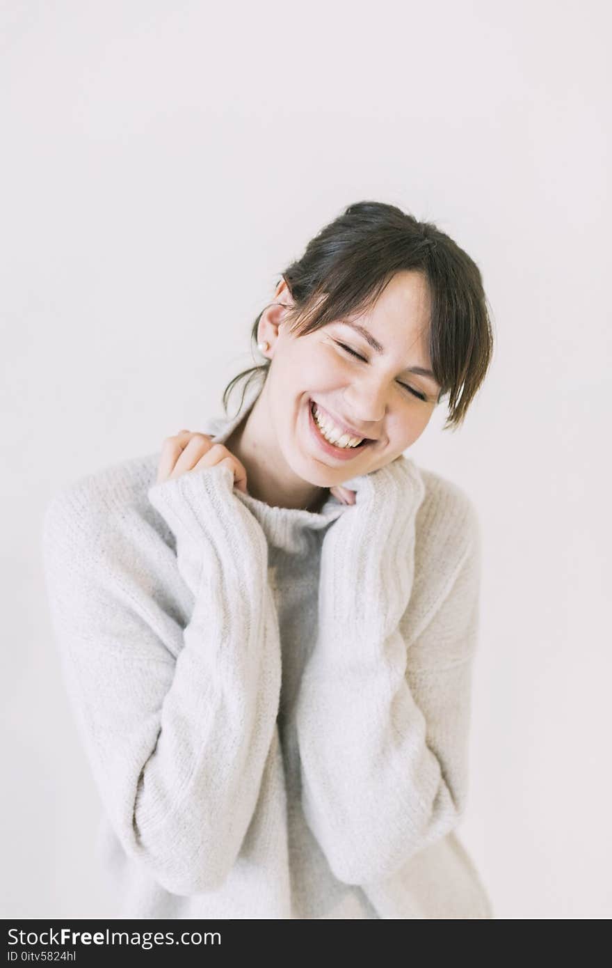 Woman Wearing White Turtle-neck Sweater