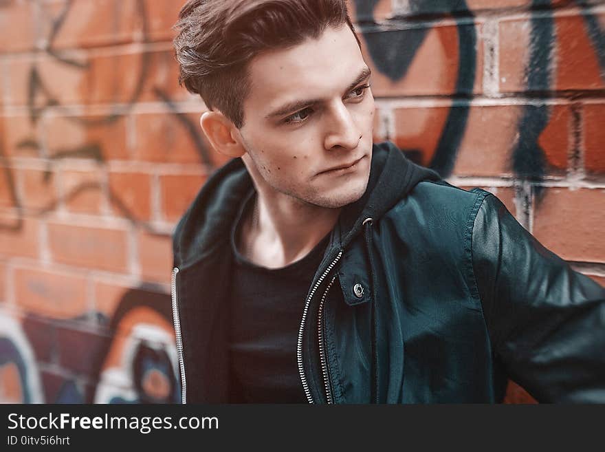 Close-up Photography of Man Wearing Leather Jacket