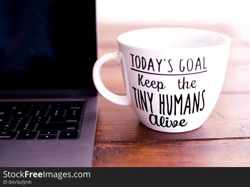 White and Black Today&#x27;s Goal Print Ceramic Mug Beside Laptop Computer