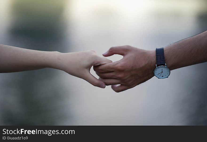 Man and Women Holding Hand