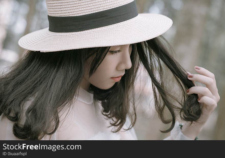 Woman Wearing White and Black Hat