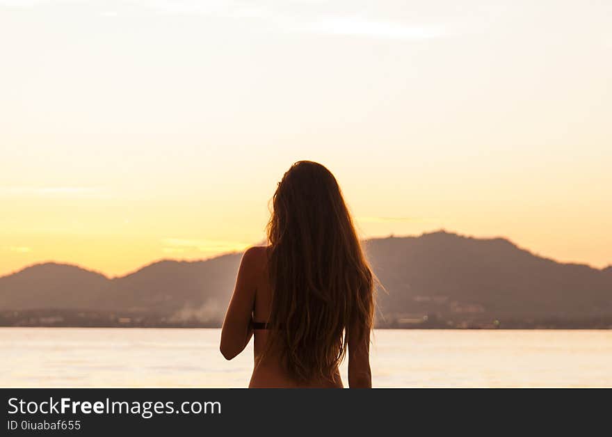 Woman Standing in Front of the Sea