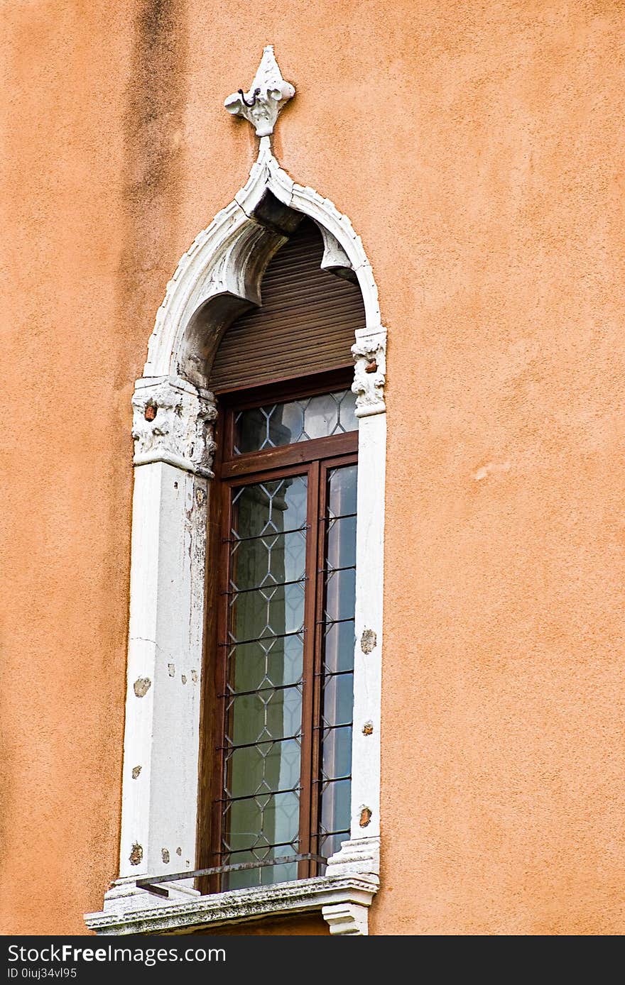 Vertical: Intricate art, sculptures and masonry adorn the historic buildings in Venice, Italy.