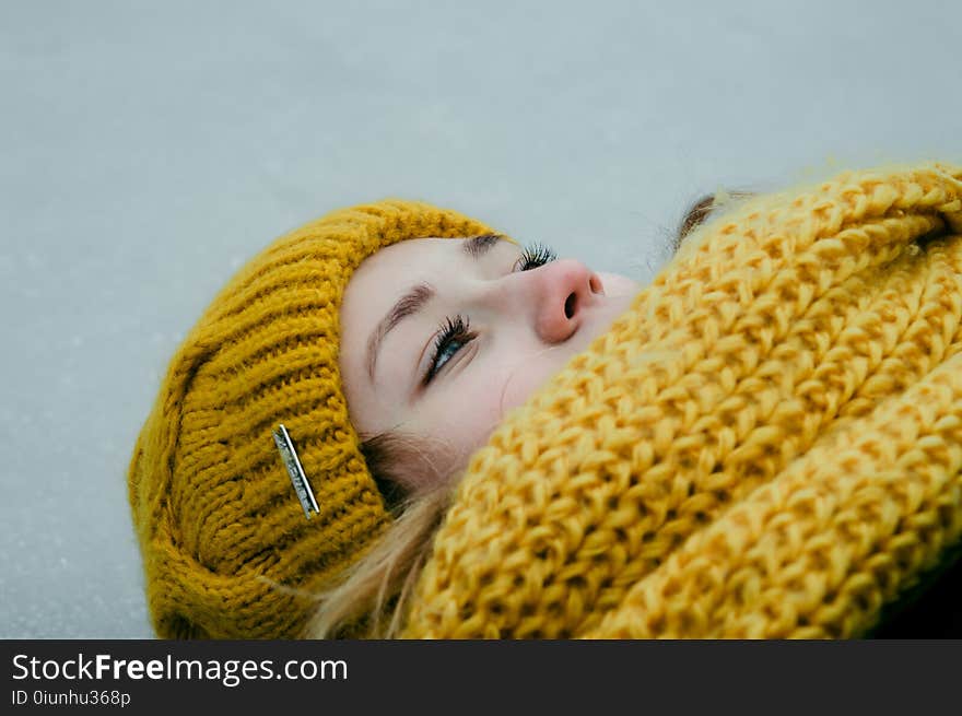 Woman Wearing Yellow Crochet Cap and Scarf