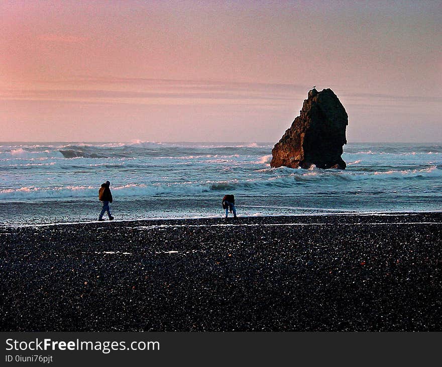 Two People at the Seashore during Dawn