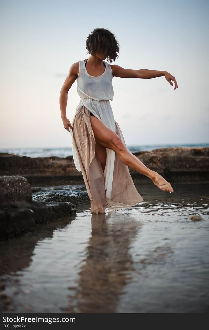 Woman Wearing White Tank Dress Posing in Body of Water