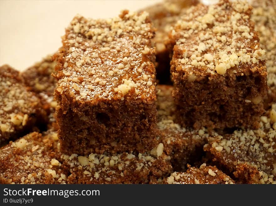 Brownie chocolate cookies sprinkled with chopped nuts on the plate