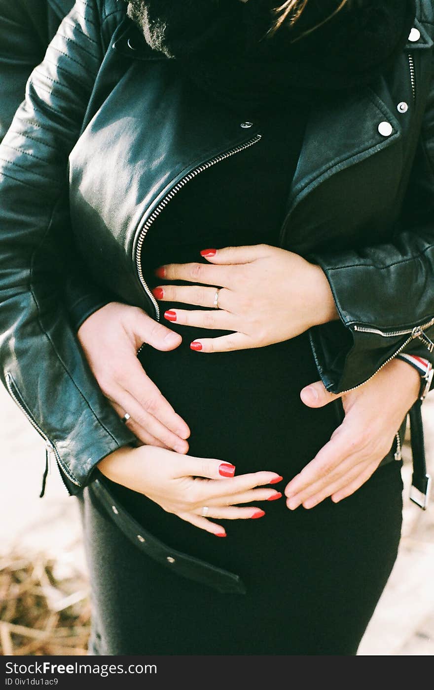 Photo of a Woman Wearing Black Leather Jacket