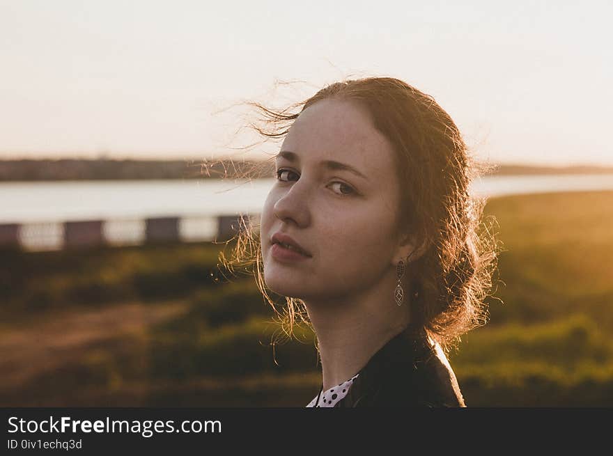 Tilt Shift Lens Photography of Woman during Sunset