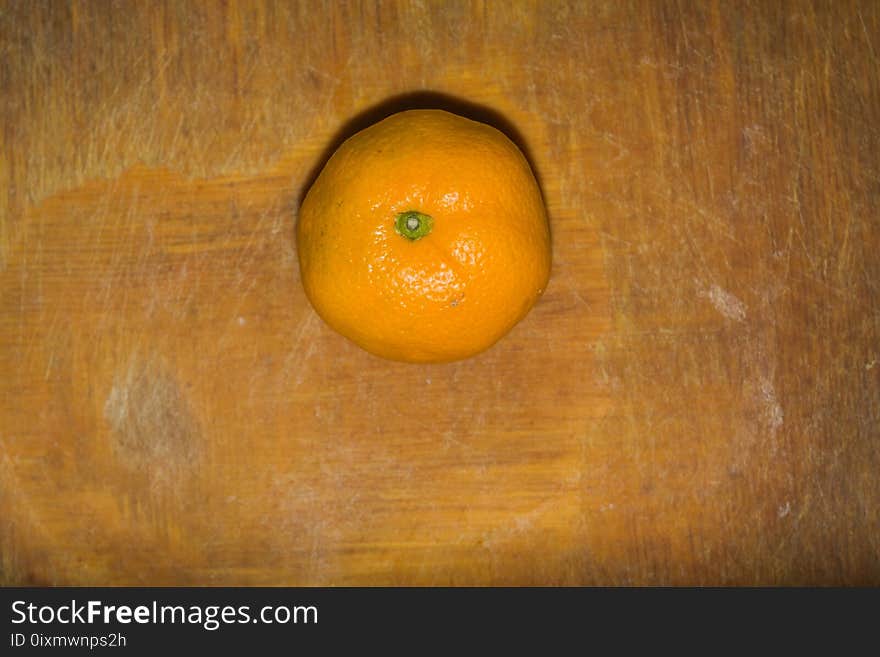 Orange on a Cutting Board