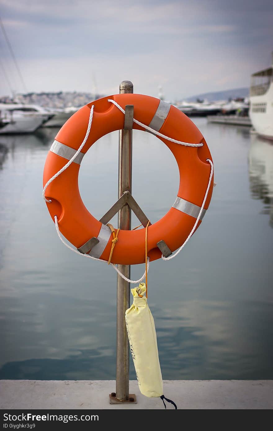 Bright orange lifebuoy on the sea water background. Athens, Greece