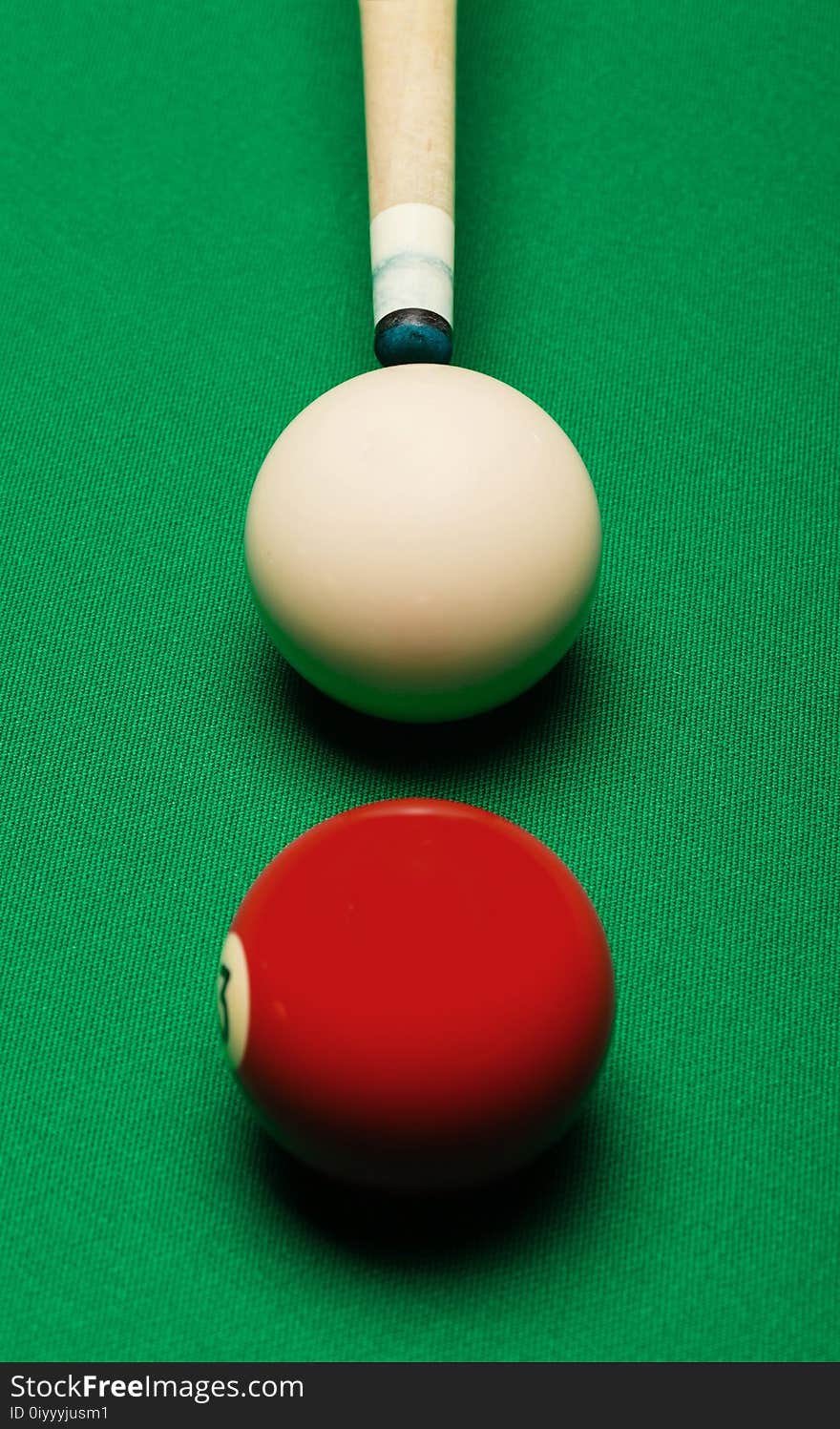 Billiard balls in a pool table.