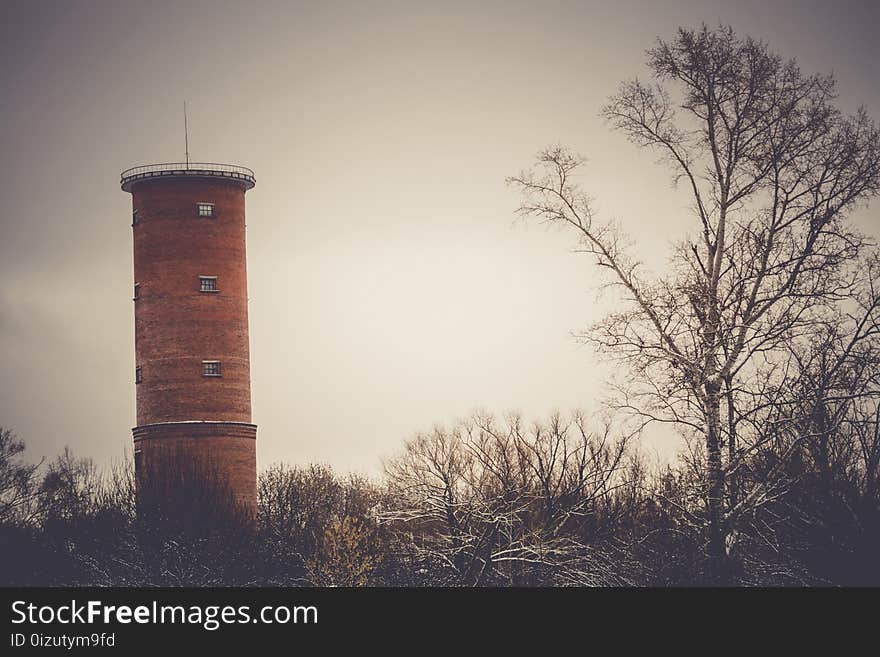 Vintage style red brick water tower of an old factory, filtered. Vintage style red brick water tower of an old factory, filtered.