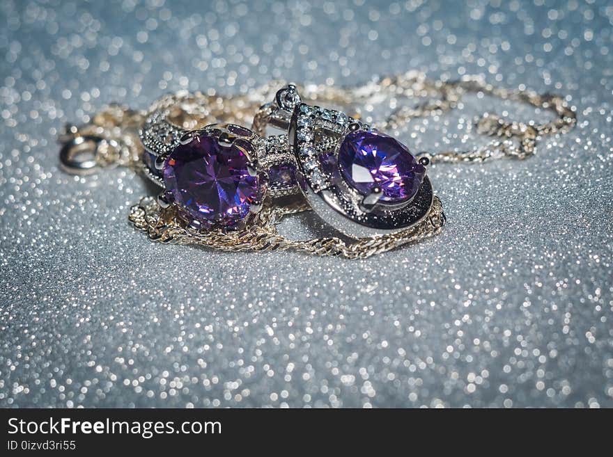 Fashion silver pendant with purple zirconia, amethyst imitation.