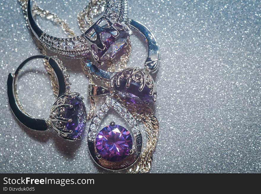 Fashion silver pendant with purple zirconia, amethyst imitation.