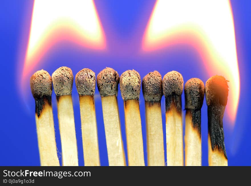 Burning, Matches On Deep Blue Background. Burning, Matches On Deep Blue Background