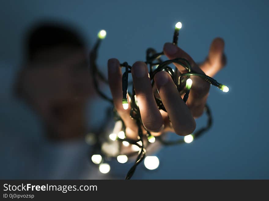Hand with the christmas lights