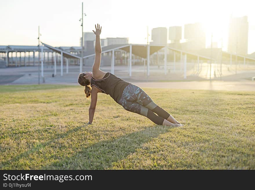 A Young woman doing yoga exercise outdoor