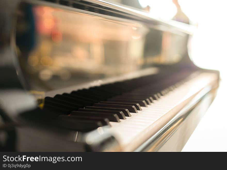 Black grand piano has piano key placed in hallroom. this image for music artist art instrument entertainment concept.