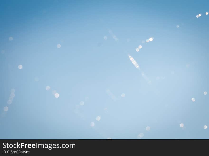 Blurred Waterdrops on Cobweb