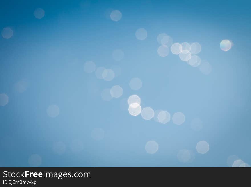 Defocused water drops on a spider web, bokeh effect, natural background. Defocused water drops on a spider web, bokeh effect, natural background.