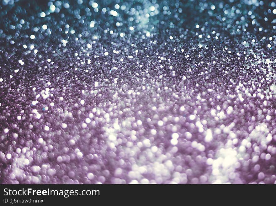 Decorative glitter silver and purple as abstract filtered background. Decorative glitter silver and purple as abstract filtered background