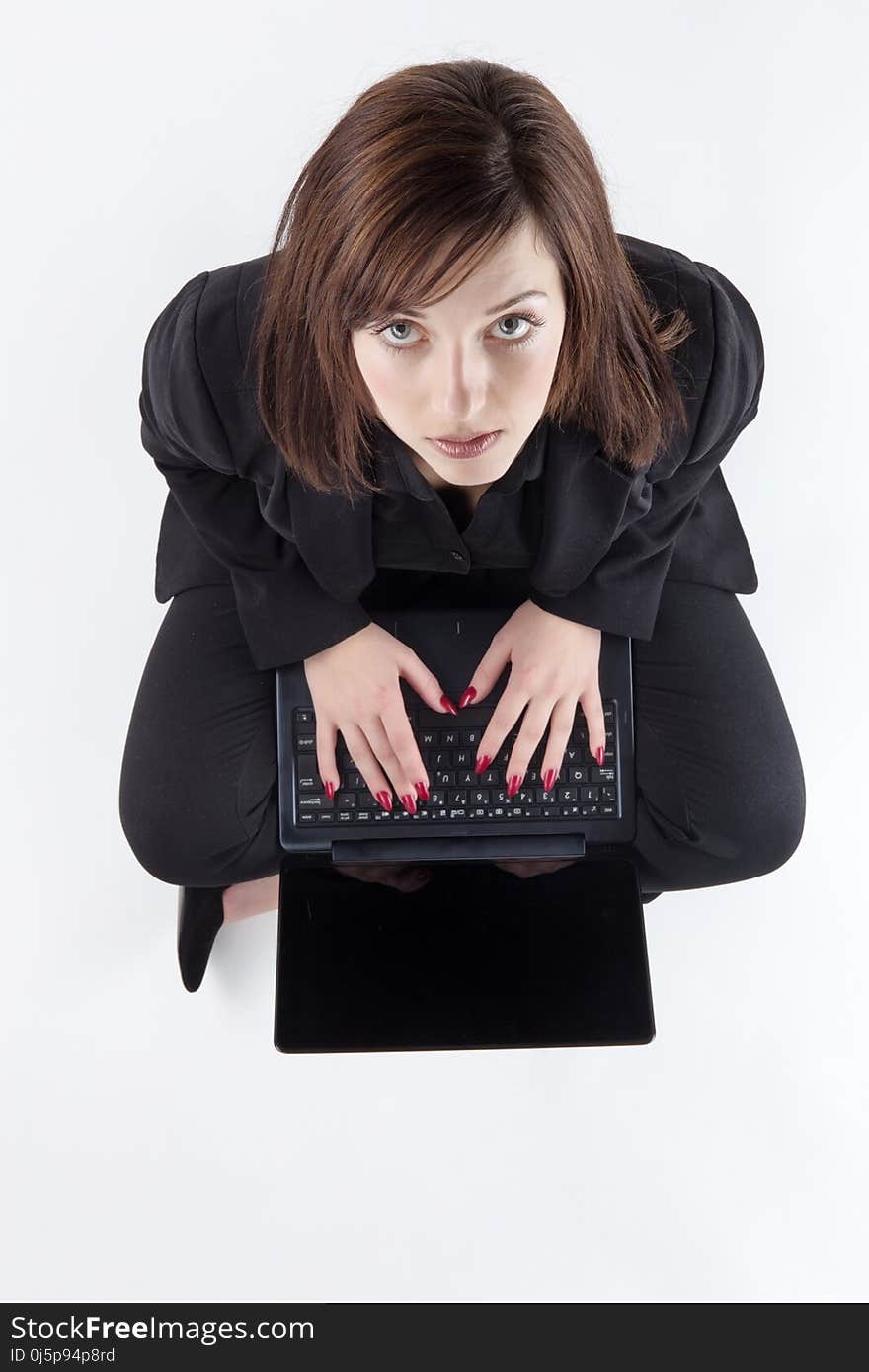 Business woman sitting on the ground shot from above. Business woman sitting on the ground shot from above